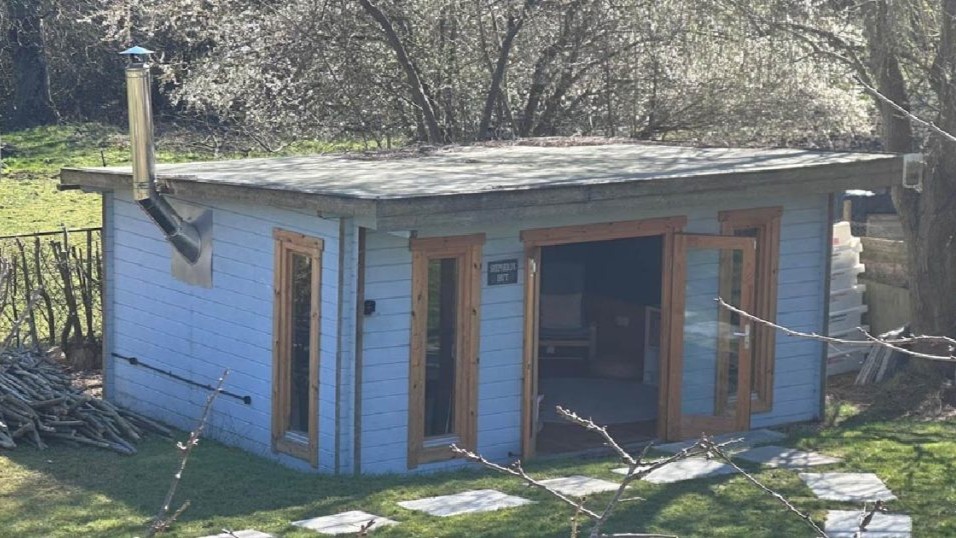shepherd's hut exterior shot from garden